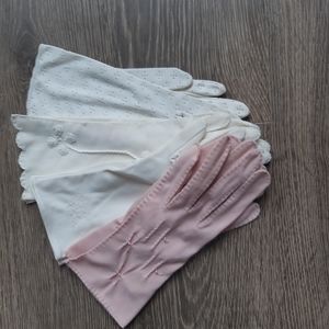 Vintage gloves from the 50s + 60s. 3 white and 1 pink. Beautiful details.